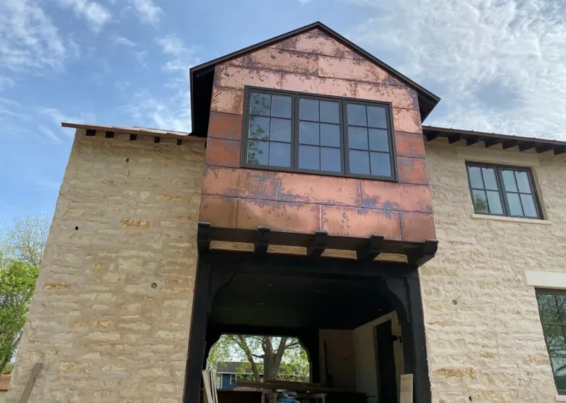 Copper metal panel facade on a stone building for Skylight Installation in Sunrise Manor